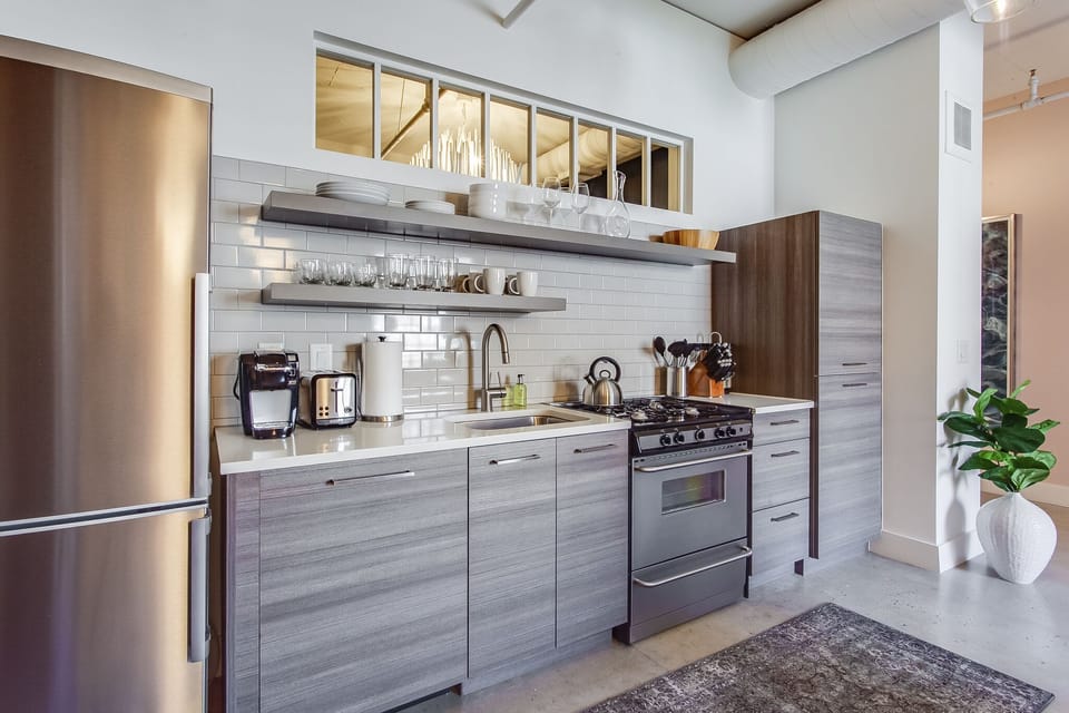 Modern Kitchen Includes Stainless Steel Appliances.
