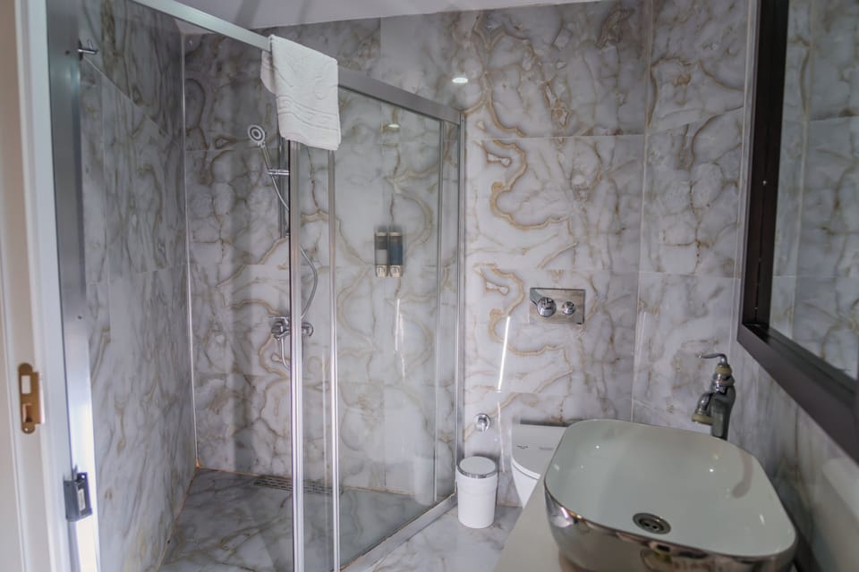 Suite, Jetted Tub | Bathroom | Shower, slippers, towels