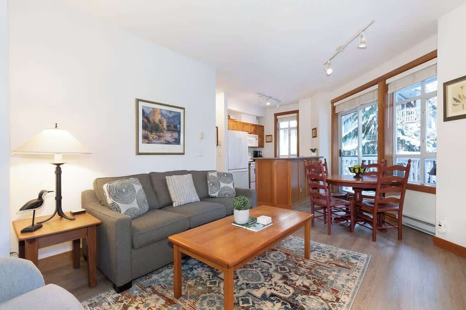 - Open-concept living and dining area with inviting natural light and comfort  
- Thoughtfully designed for relaxation with cozy seating and mountain touches  
- Ideal gathering space for couples or families visiting Whistler’s trails  