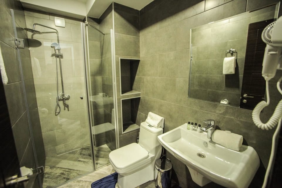 Double Room, Balcony | Bathroom | Free toiletries, hair dryer, slippers, towels