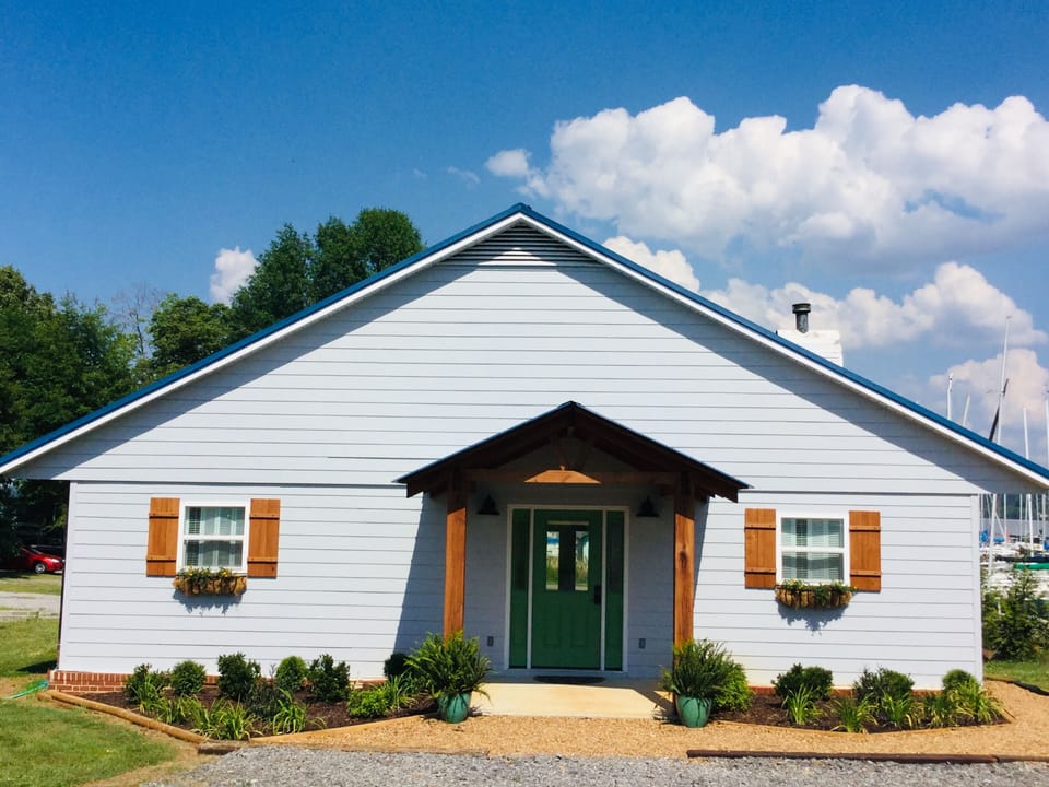 View of cottage from Browns Creek Road with  parking in front.
