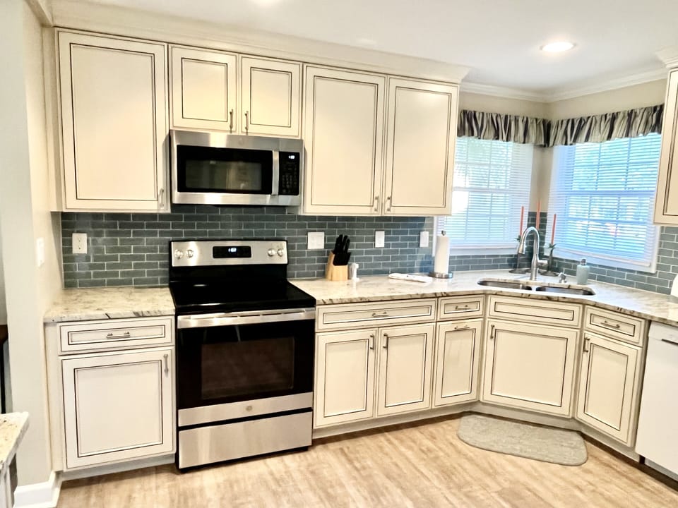 Beautiful soft close cabinets with GE Electric Stove and Microwave 