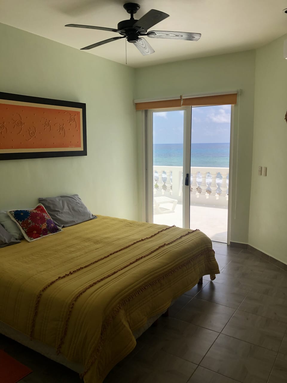 bedroom with a balcony ocean view