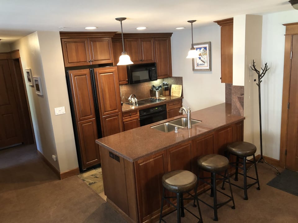 Fully stocked kitchen with granite counter tops
