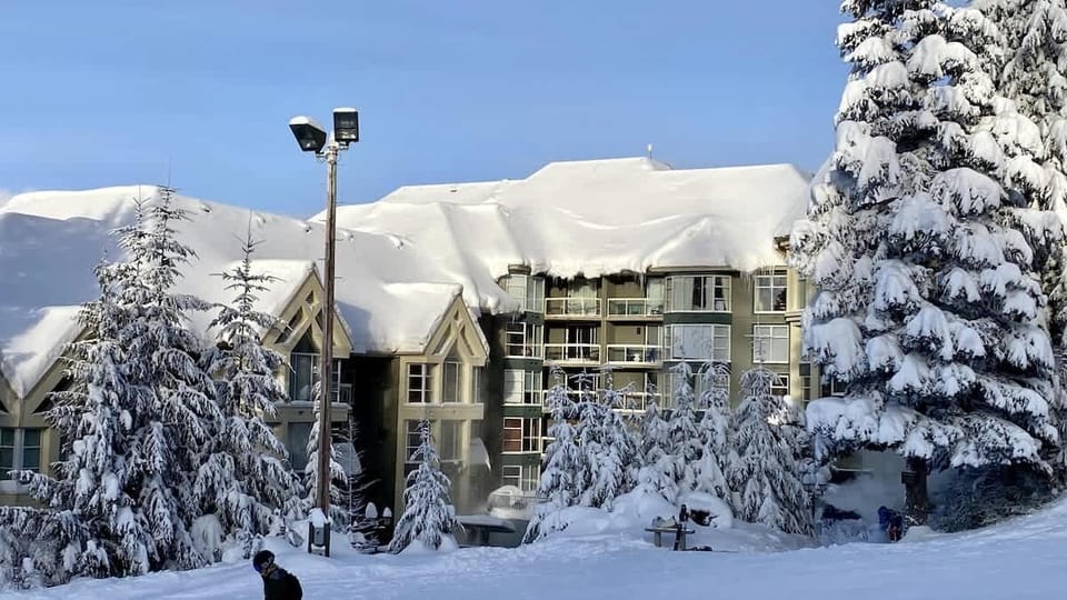 - Snowy mountain retreat steps from the slopes for a true ski-in ski-out experience  
- Panoramic alpine views framed by frosted evergreens and powder-white peaks  
- Cozy escape in the heart of a winter wonderland near Whistler Village  
