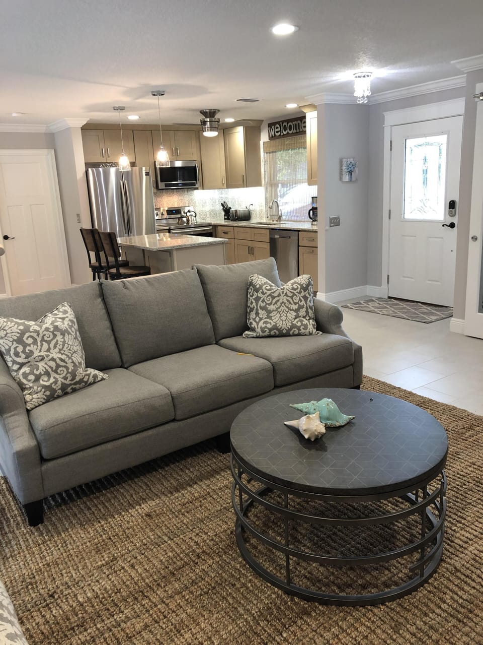 Living room with couch , Loveseat , chair and cable t.v 