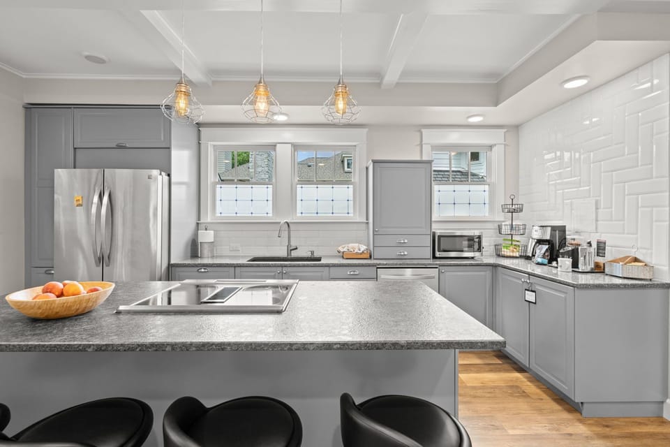 Kitchen— electric cooktop, convection oven, quartz sink, dishwasher, microwave