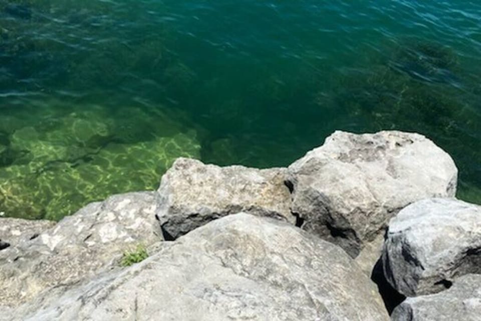 View standing on the boulders at the end of the lot. Wear water shoes, slippery!