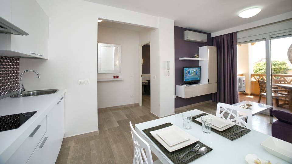 Superior Apartment, 1 Bedroom (2 adults + 2 children) | Living area | 26-inch flat-screen TV with digital channels, LCD TV