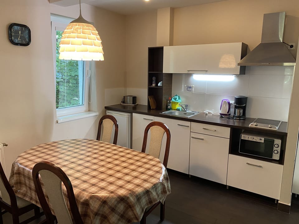 Family Apartment, 2 Bedrooms, Balcony, Garden Area | Private kitchen | Full-size fridge, microwave, stovetop, coffee/tea maker