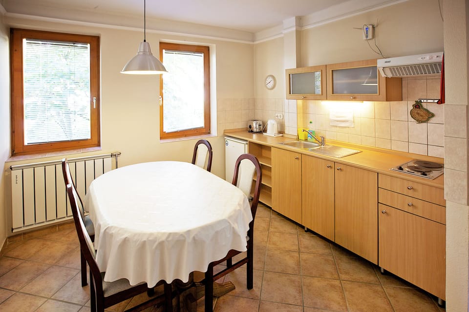 Family Apartment, 2 Bedrooms, Balcony, Garden View | In-room dining