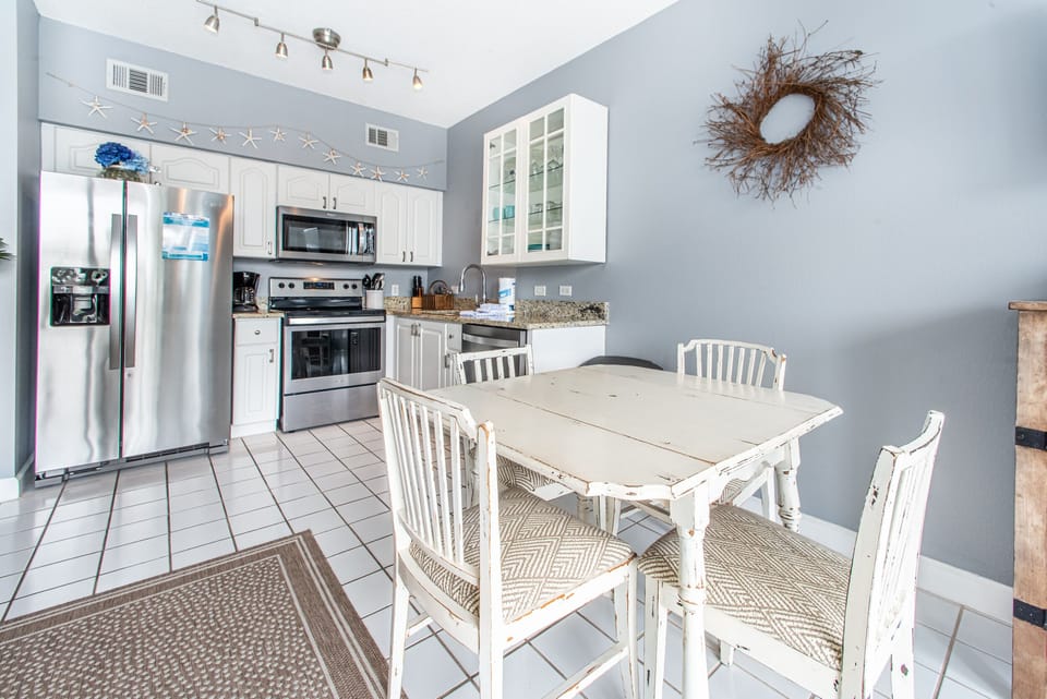 Dining room table adjacent to kitchen