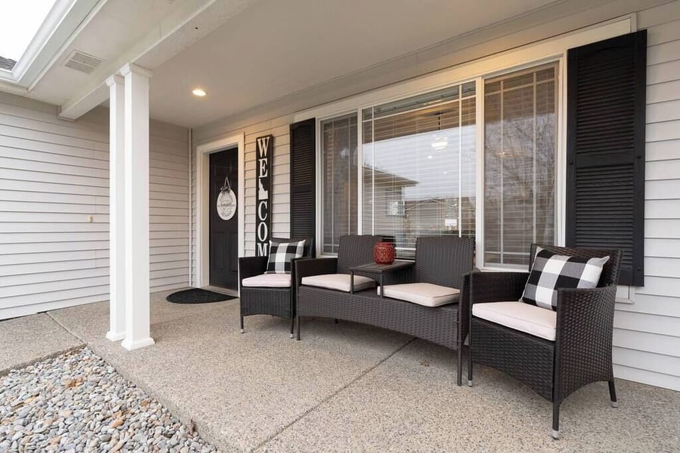 There is a cozy seating area on the front porch.