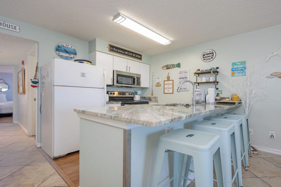 The kitchen features granite countertops, stainless appliances, and a cozy dining area, perfect for enjoying meals together