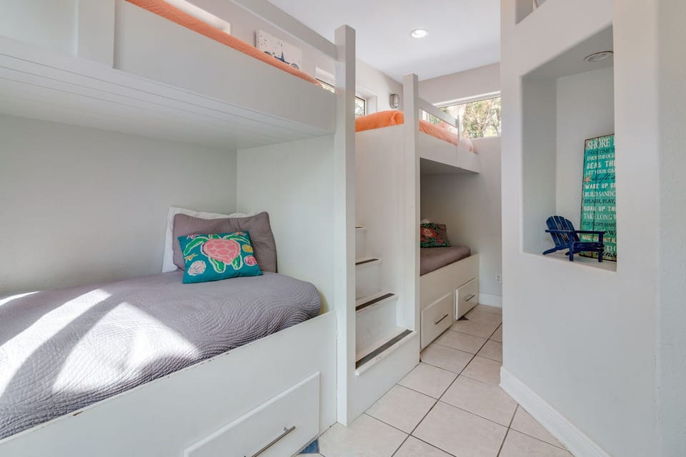 BR #5 has 4 twin beds with drawer for each person.