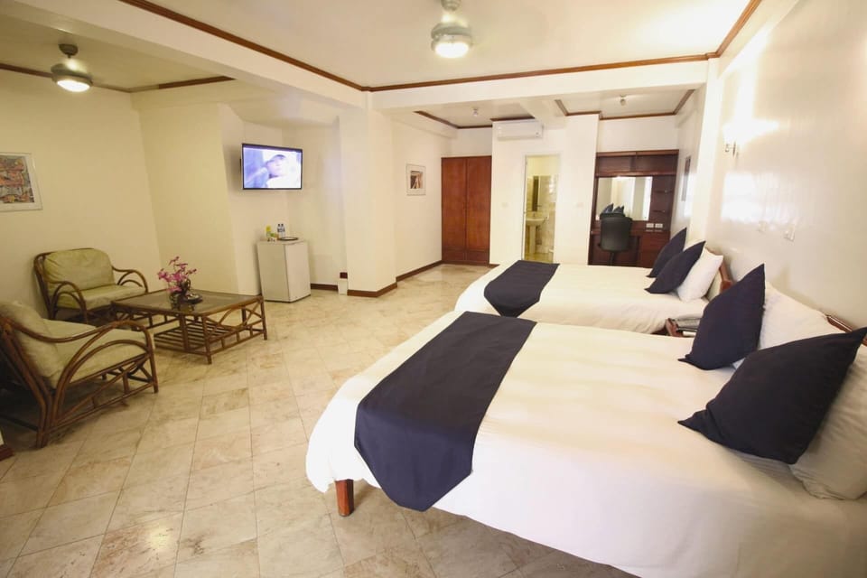 Suite, 2 Queen Beds, Poolside | Minibar, in-room safe, blackout drapes, iron/ironing board