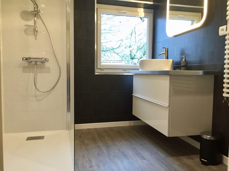 Family Room (La Longere) | Bathroom | Shower, hair dryer, towels, toilet paper