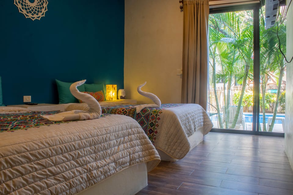 Superior Quadruple Room | Down comforters, minibar, in-room safe, individually decorated