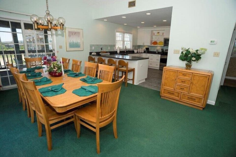 Your spacious dining area awaits—perfect for gathering everyone around the table, sharing meals, and making memories with loved ones. The adjacent kitchen keeps conversation flowing while you cook.