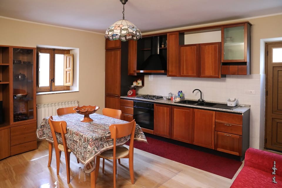 Family Apartment, 1 Bedroom | Private kitchen | Cookware/dishes/utensils
