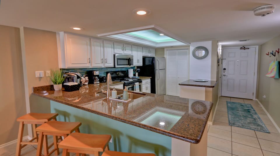 Remodeled kitchen with new backsplash & fully stocked with everything you need.