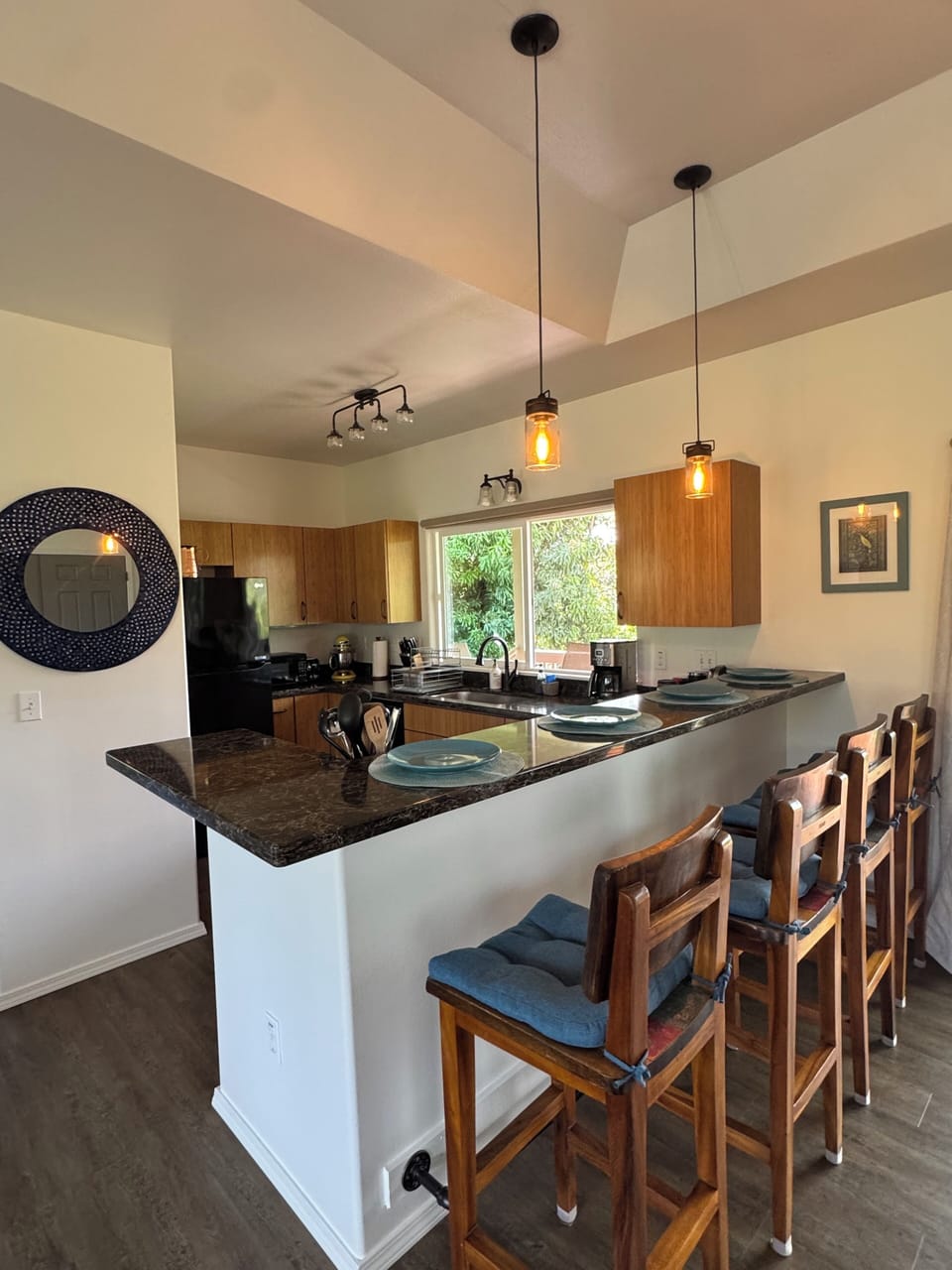 Side bar view of kitchen entrance & teak bar stools
