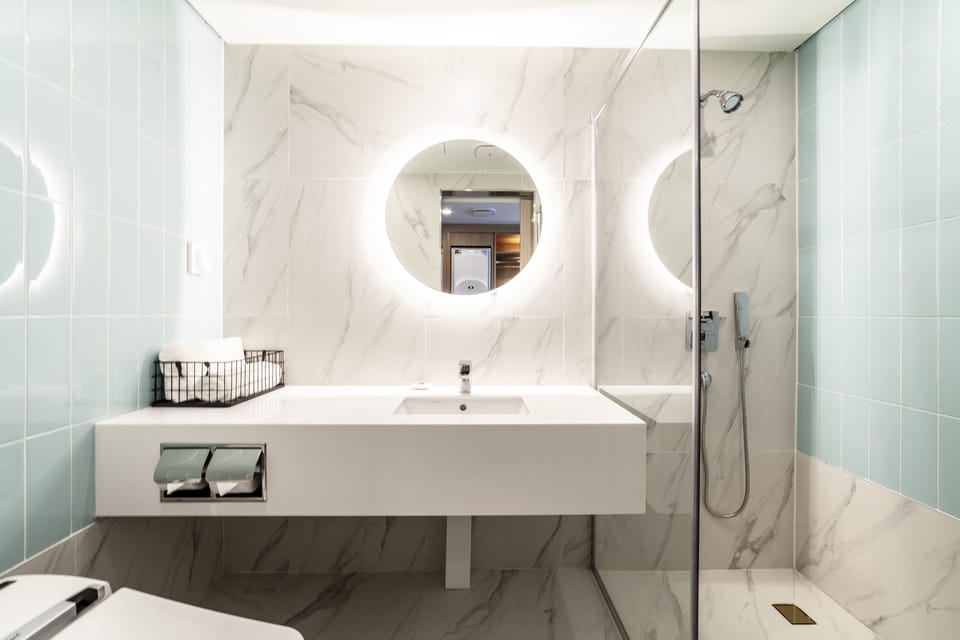 Deluxe Terrace | Bathroom | Shower, designer toiletries, hair dryer, bathrobes