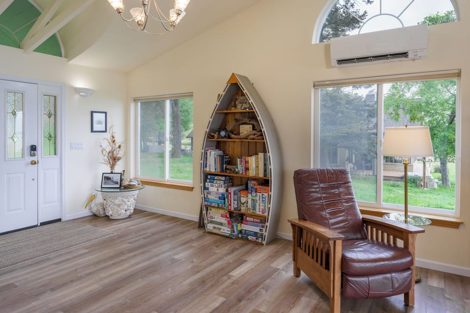 Sink into your favorite chair with a good book from the boat-shaped shelf, while natural light pours through oversized windows and cool air keeps you comfortable.
