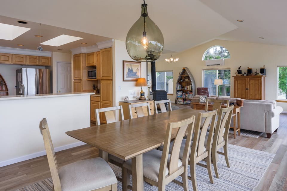 Your open-concept living space seamlessly blends comfort and style. Gather around the spacious dining table, whip up meals in the fully-equipped kitchen, then relax in the cozy living area.