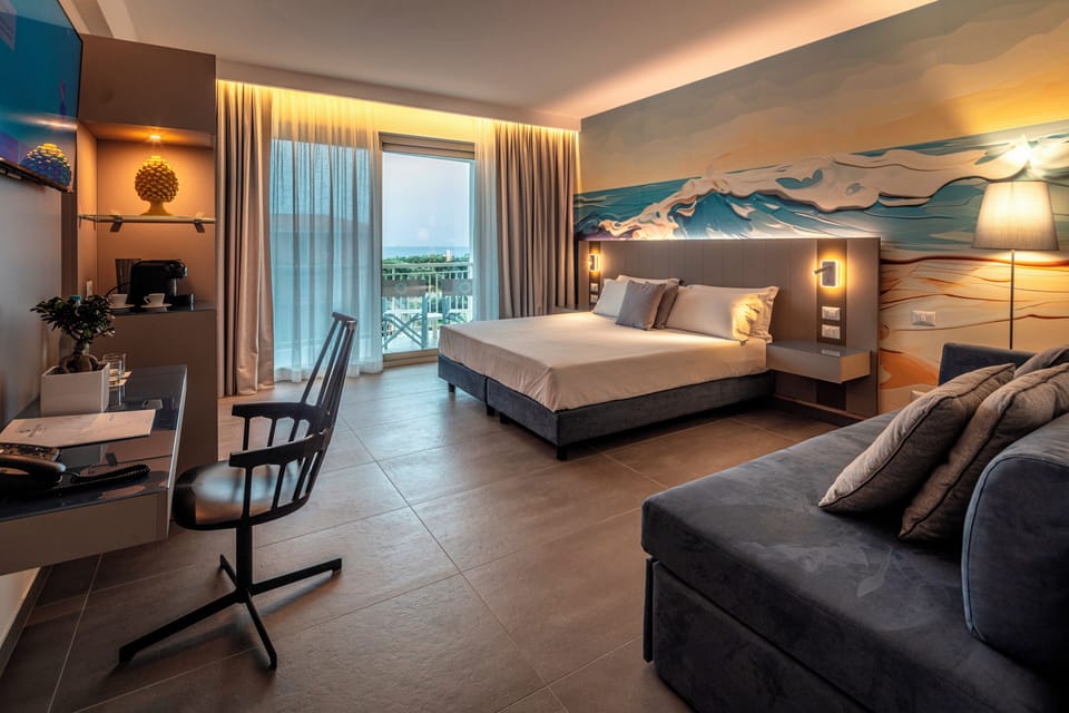 Deluxe Quadruple Room | In-room safe, desk, blackout drapes, soundproofing