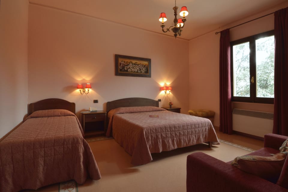 Triple Room | Minibar, in-room safe, desk, iron/ironing board