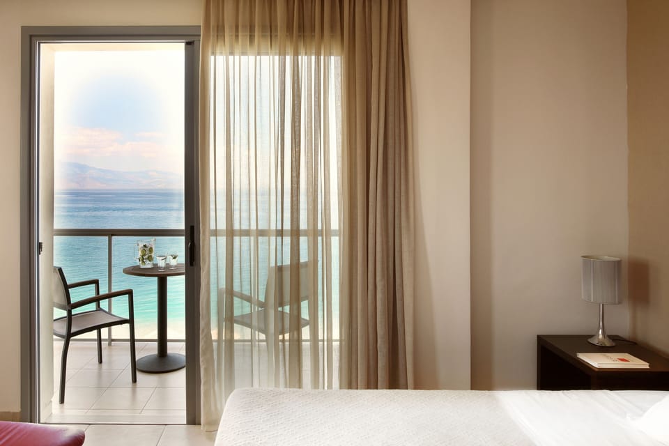 Deluxe Triple Room | Minibar, in-room safe, desk, blackout drapes