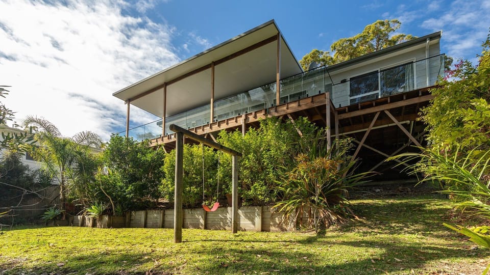 Exterior View of House with Elevated Deck