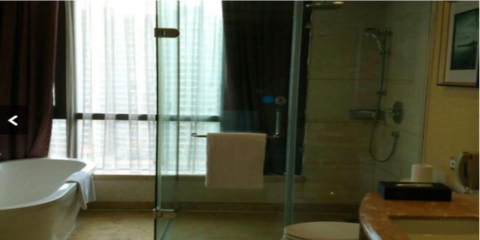 Separate tub and shower, rainfall showerhead, free toiletries