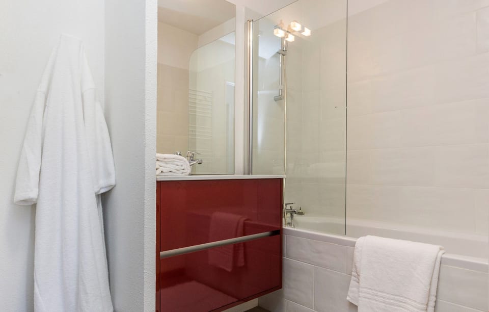 Prepare for the day in the modern bathroom.
