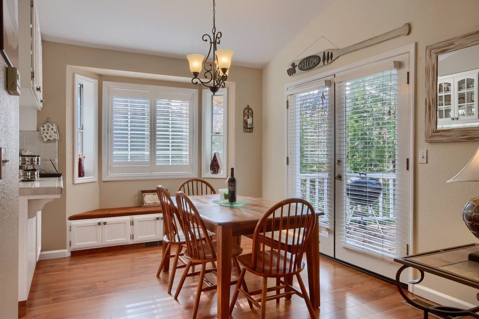 Dining Room with lots of light with French doors leading to wrap around deck