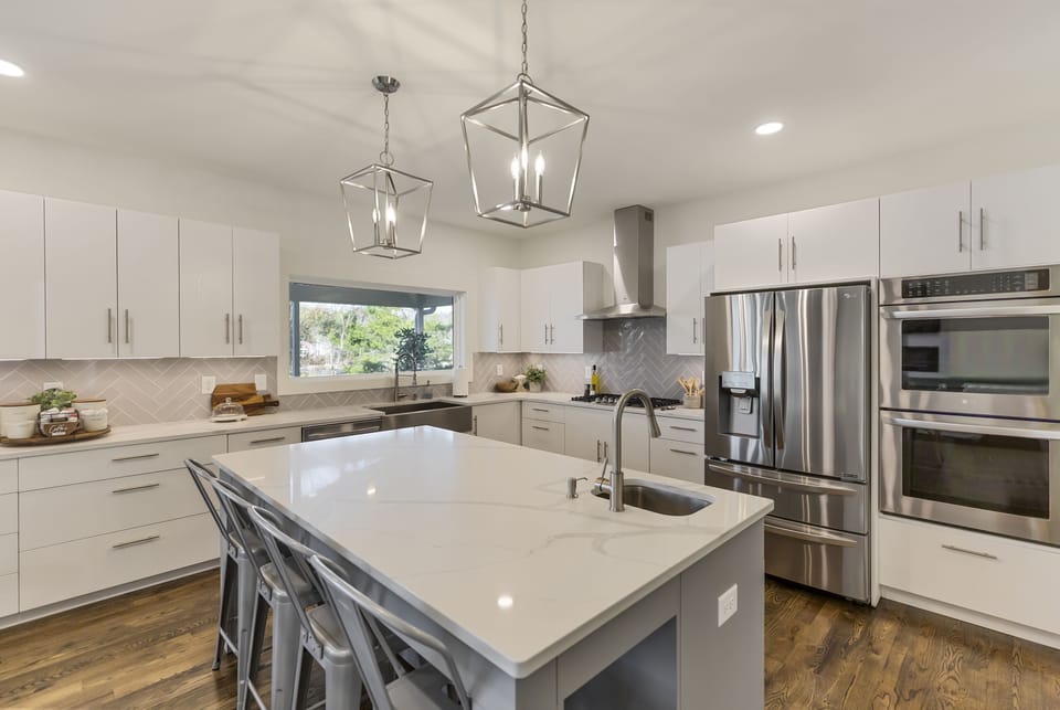 Fully stocked kitchen with double oven and large pantry. 