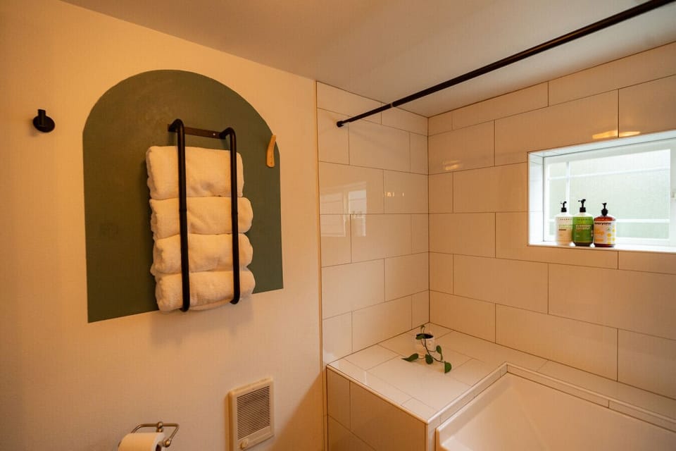 Bathroom 2. Lower level full bath with a large soaking tub and shower. -Allafia Shampoo and Conditioner and Everyone 3 in 1 Body Wash