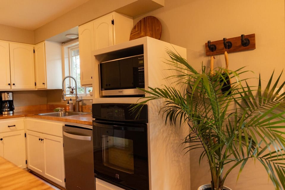 We keep our kitchen stocked w/ both stainless cookware & non toxic- non stick pots and pans. You’ll find all you need for cooking, baking and plenty of bar-ware.  -Tea -Whole coffee beans  -Salt, Pepper, Oil, Spices -Cuisinart drip coffee & Keurig