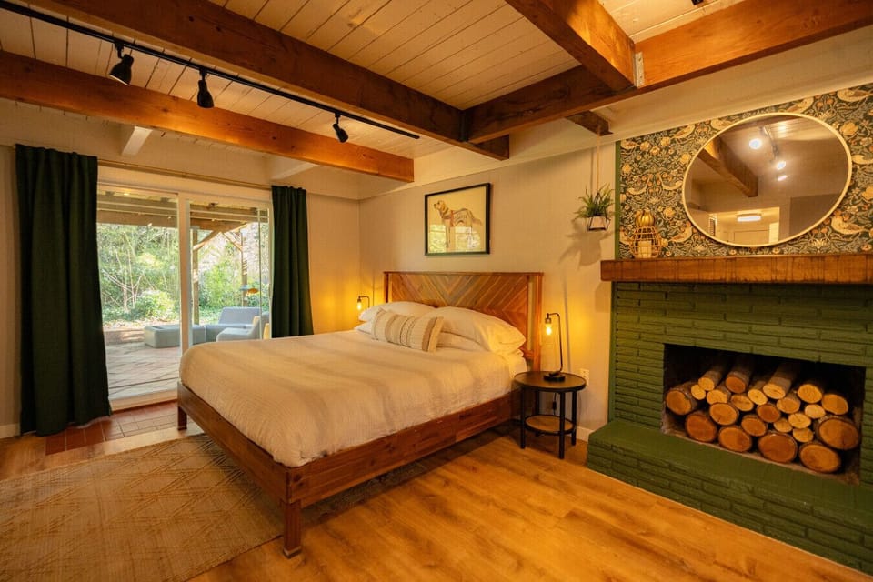 Bedroom 1: Lower level primary suite with a king size bed, couch and 50 inch smart tv. Great area for separation of space- feels like your own retreat!