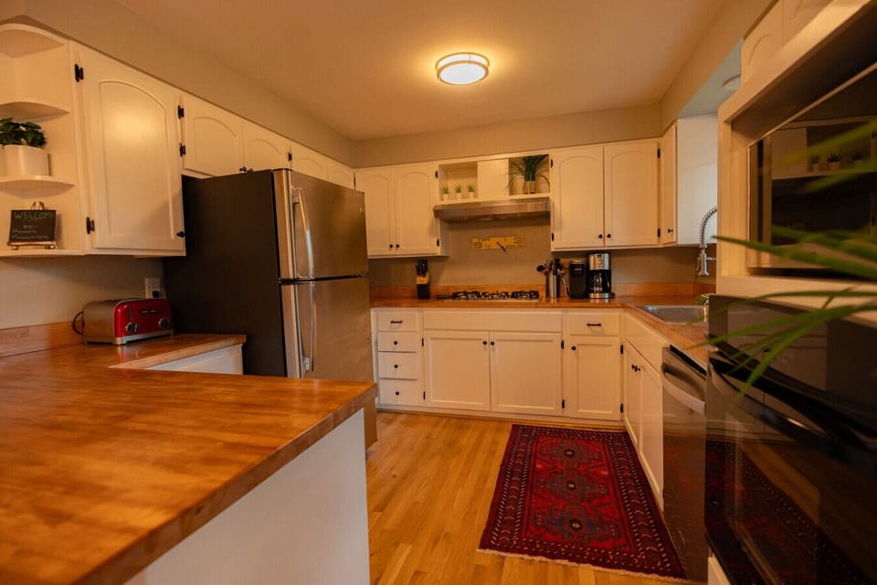 We keep our kitchen stocked w/ both stainless cookware & non toxic- non stick pots and pans. You’ll find all you need for cooking, baking and plenty of bar-ware.  -Tea -Whole coffee beans  -Salt, Pepper, Oil, Spices -Cuisinart drip coffee & Keurig