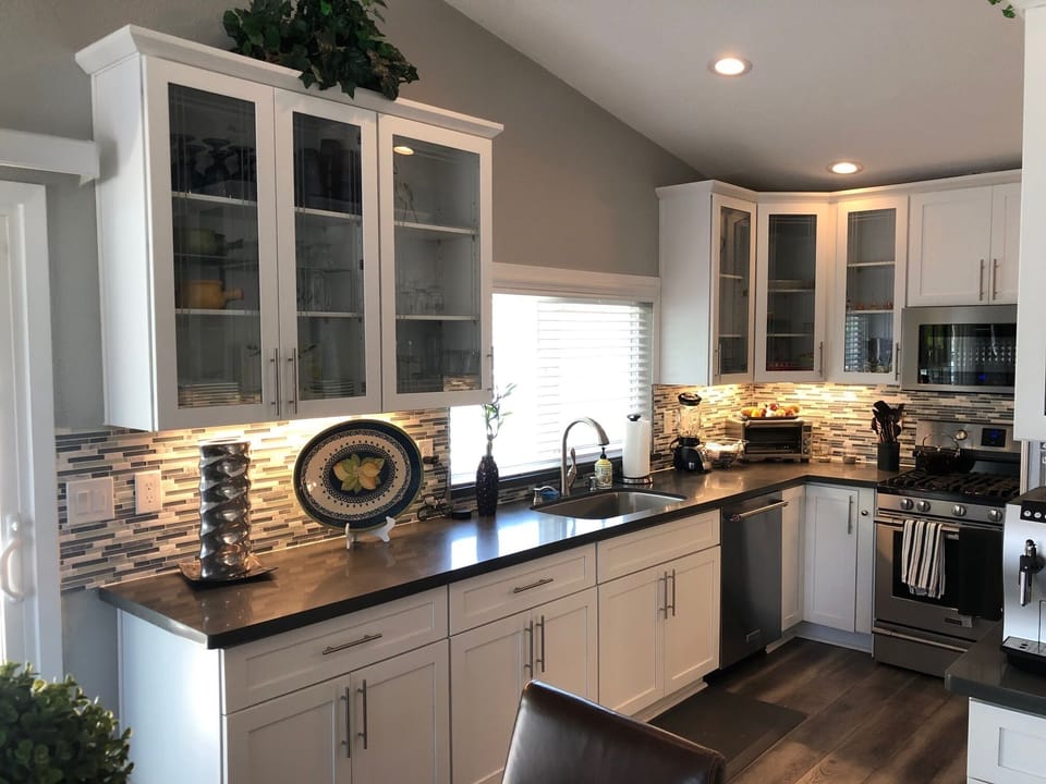 Interior kitchen shot of glazed door cabinets and quartz counters.