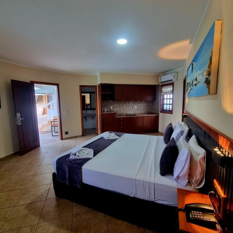 Suite, Pool View | Minibar, desk, iron/ironing board, free WiFi