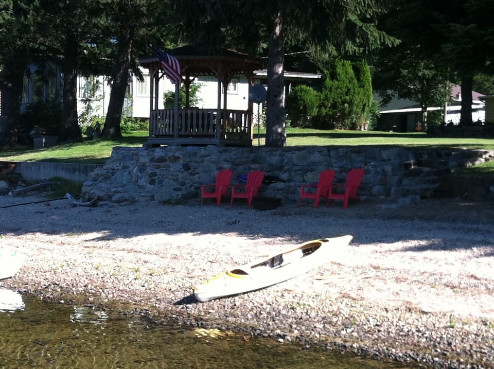 Enjoy the gazebo, sandy beach, fire pit, kayak and SUP during your stay