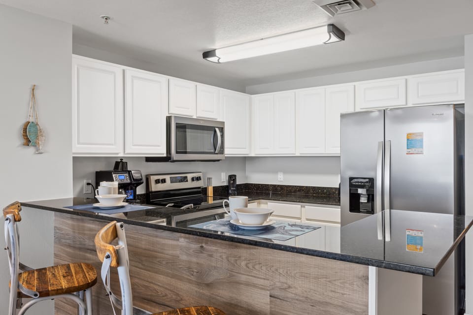 Fully Stocked Kitchen with Bar Seating