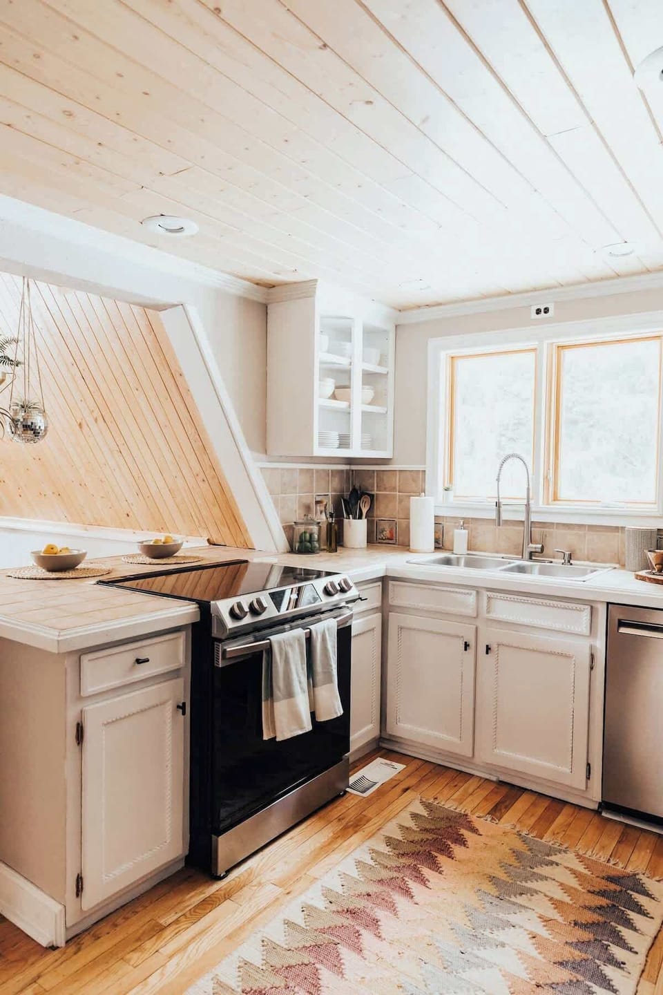 Well appointed kitchen with natural light and new appliances