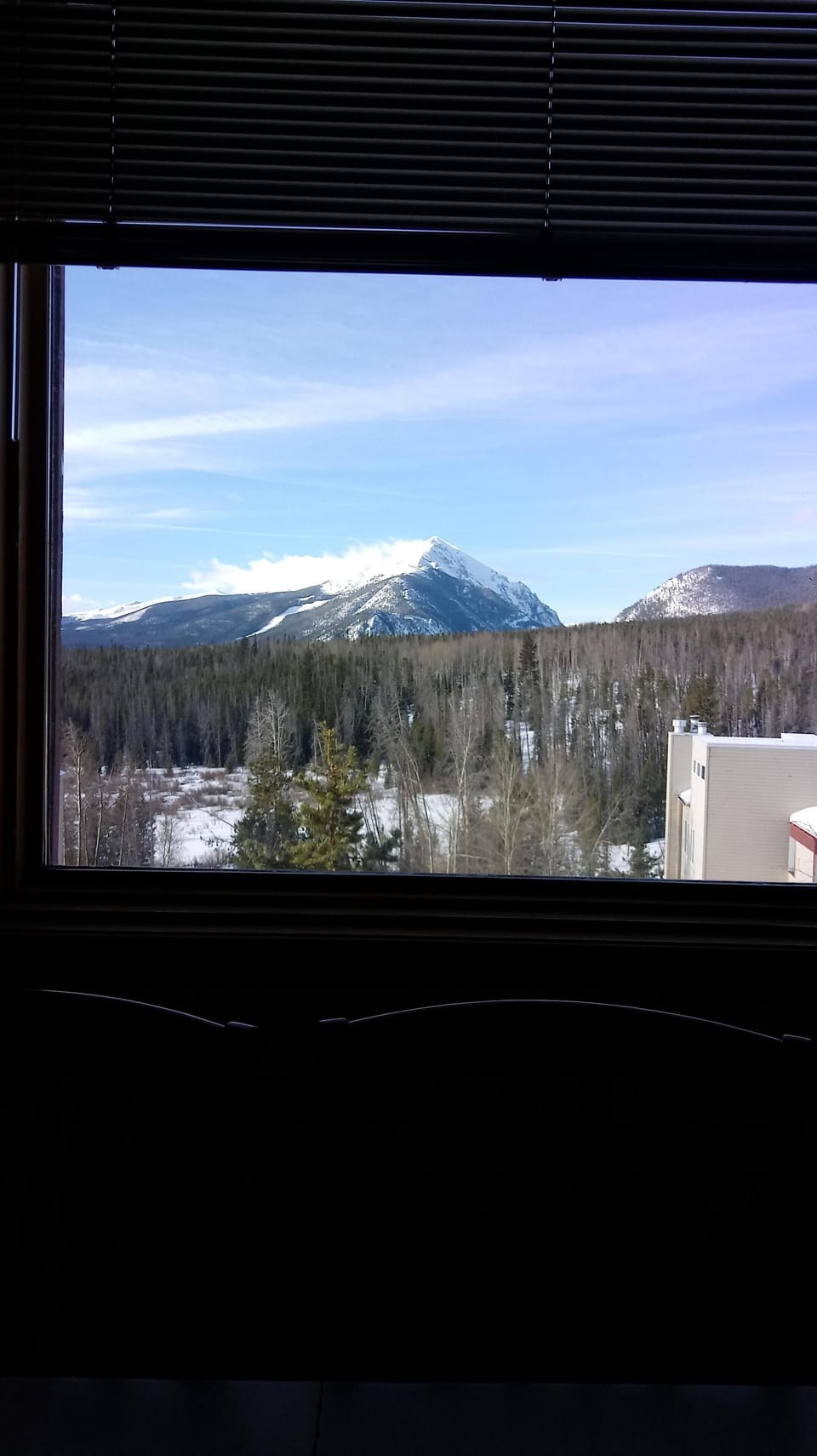Big Chief Mountain framed by the living room window.
