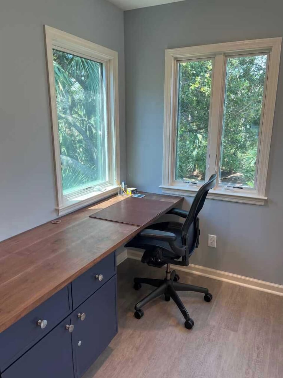 Sunroom (off kitchen) includes built-in desk. Pocket door provides privacy for zoom calls, if needed.