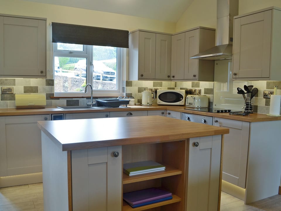 Tastefully modernised kitchen area | Woodland Lodge - Bryncoch Holidays, Hundred House, near Builth Wells