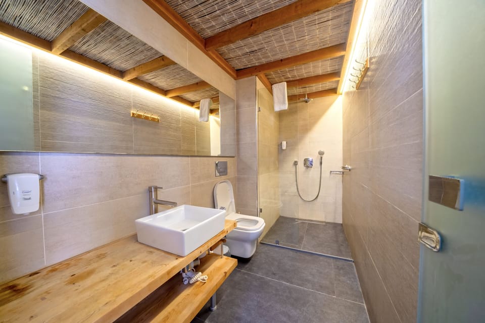 Family Quadruple Room, Balcony, Garden View | Bathroom | Shower, hair dryer, slippers, bidet